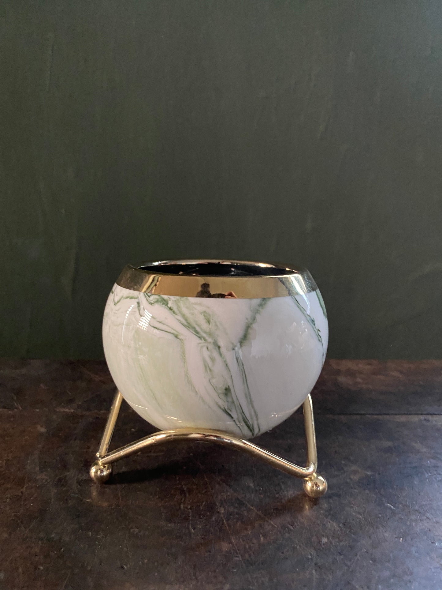 White green marble designed planter with golden stand