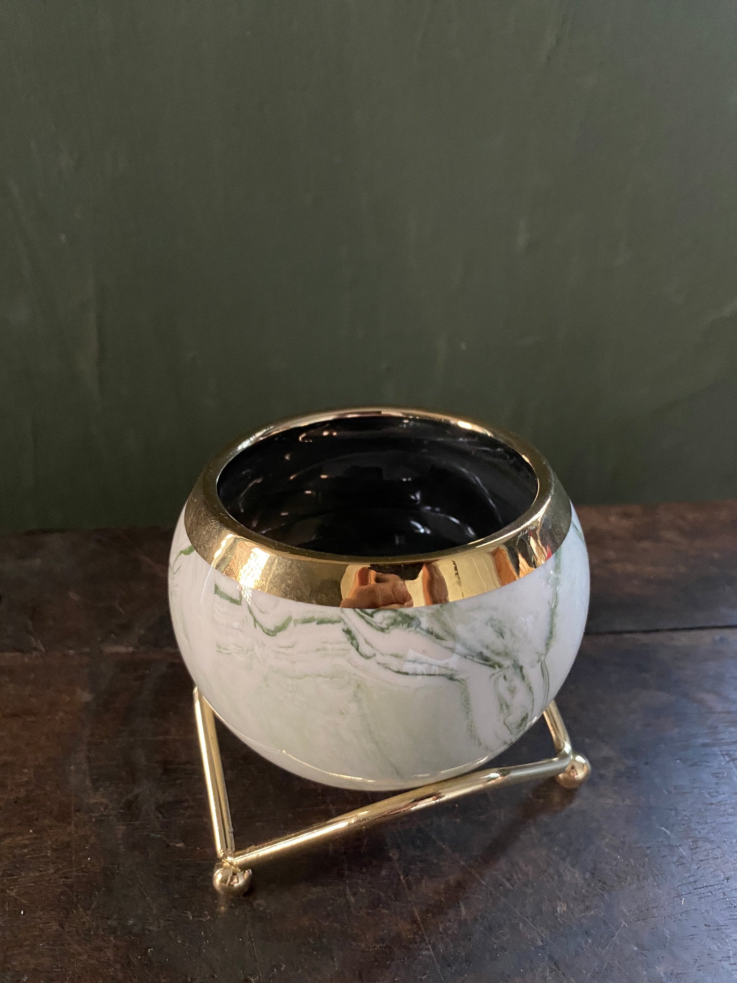 White green marble designed planter with golden stand