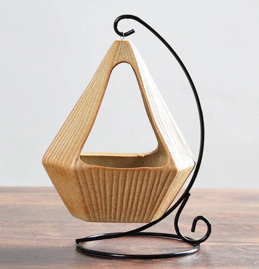 Yellow ceramic planter with metallic stand