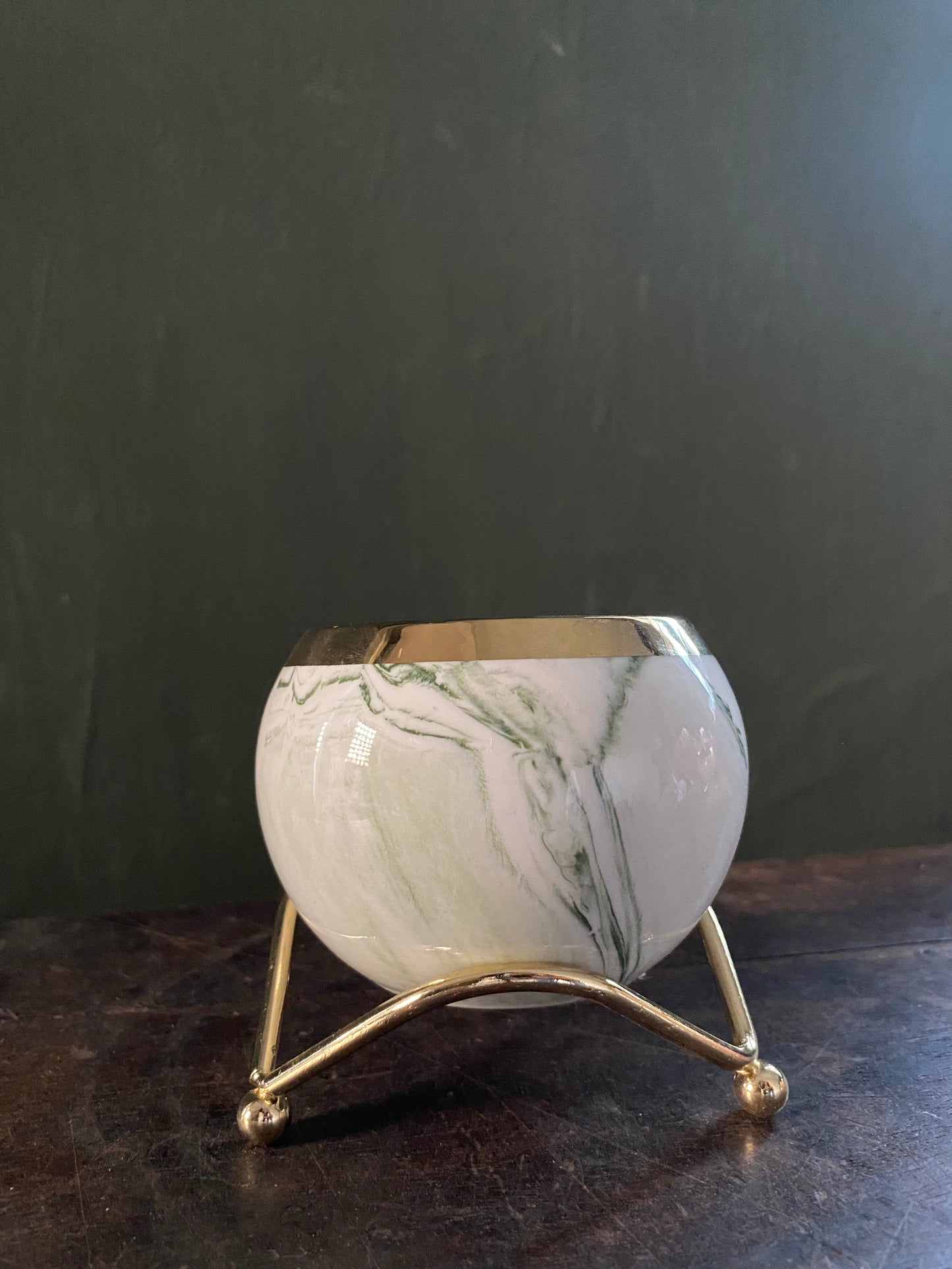 White green marble designed planter with golden stand