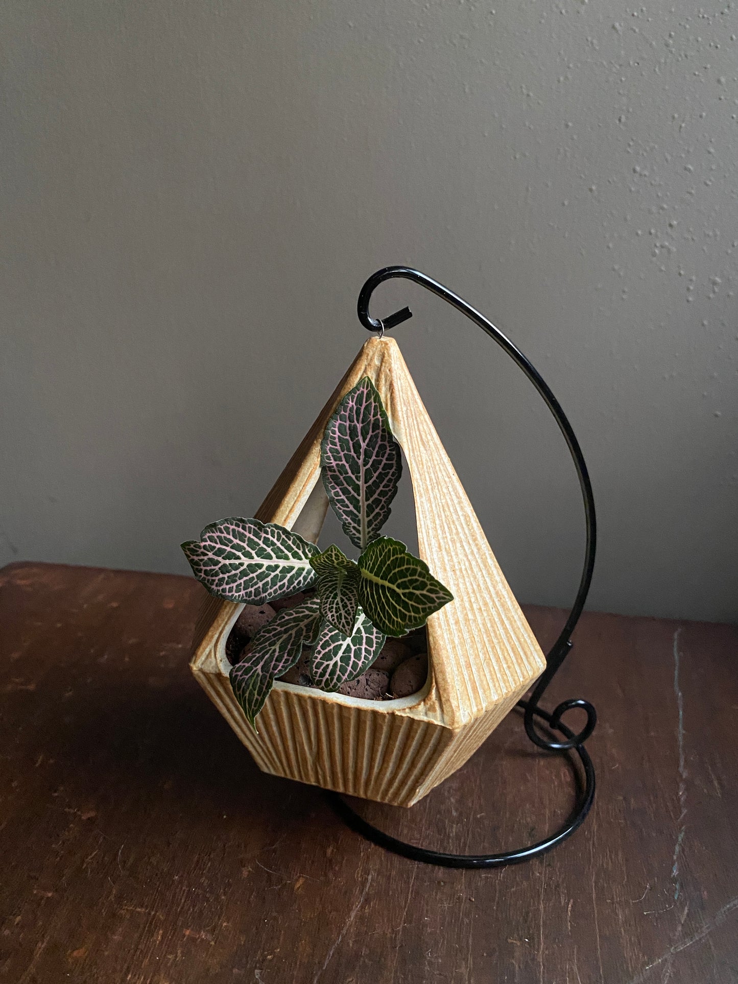 Yellow ceramic planter with metallic stand