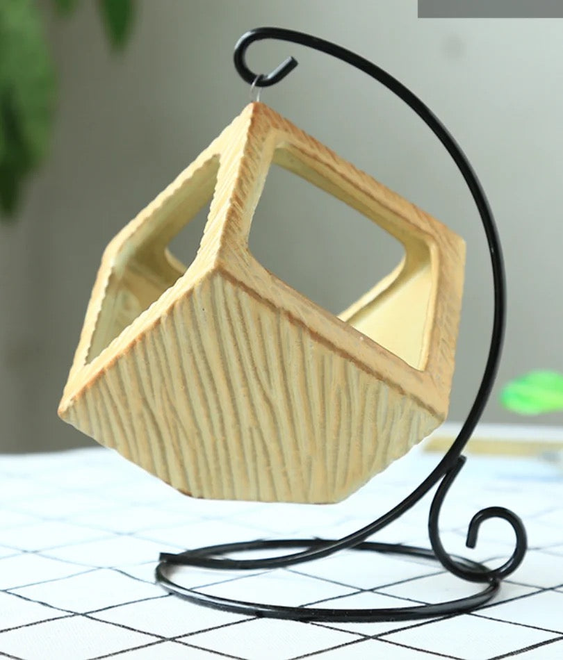 Yellow ceramic planter with metallic stand