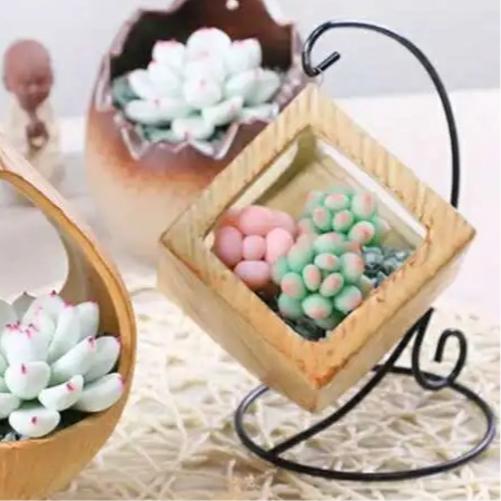 Yellow ceramic planter with metallic stand