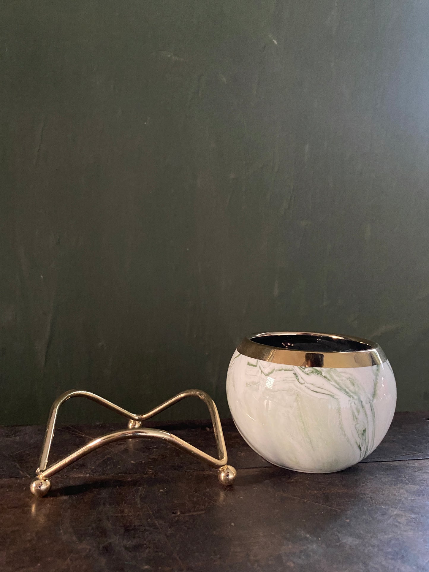 White green marble designed planter with golden stand