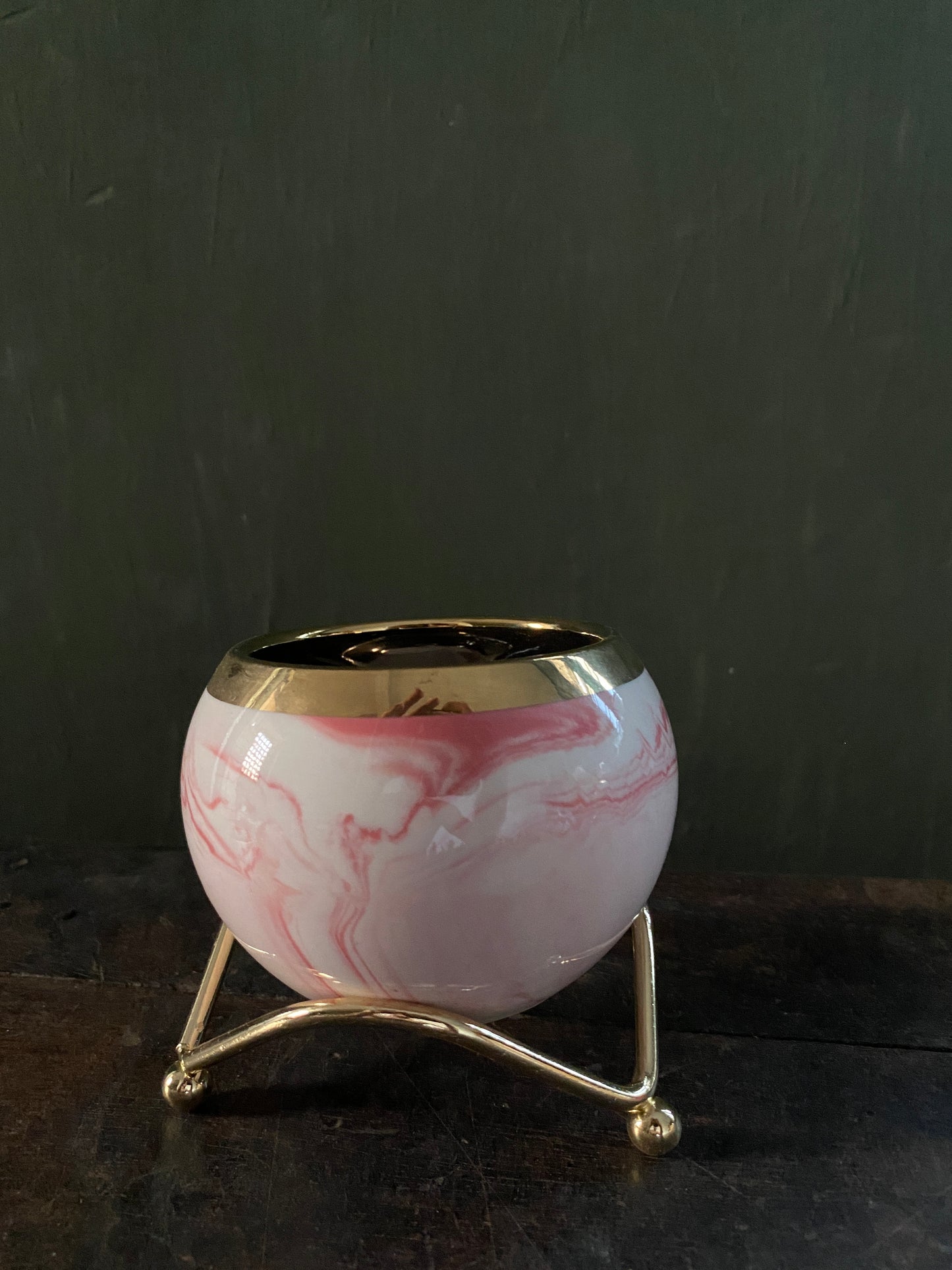 White pink marble designed planter with golden stand