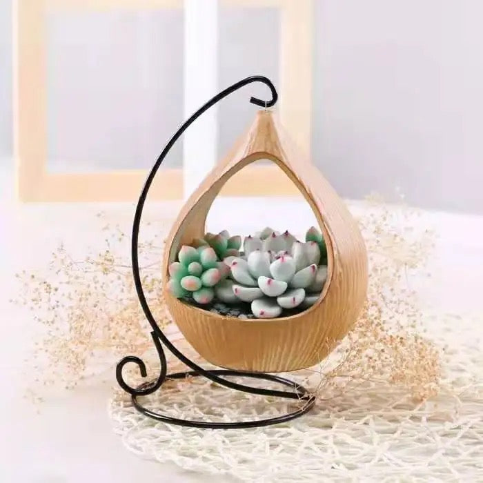 Yellow ceramic planter with metallic stand
