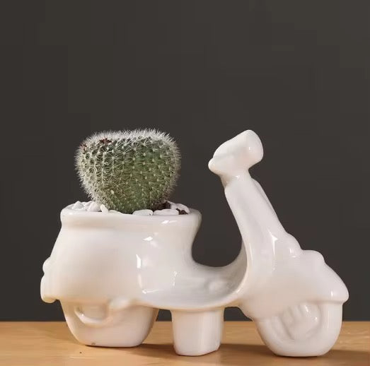 White scooter ceramic planter