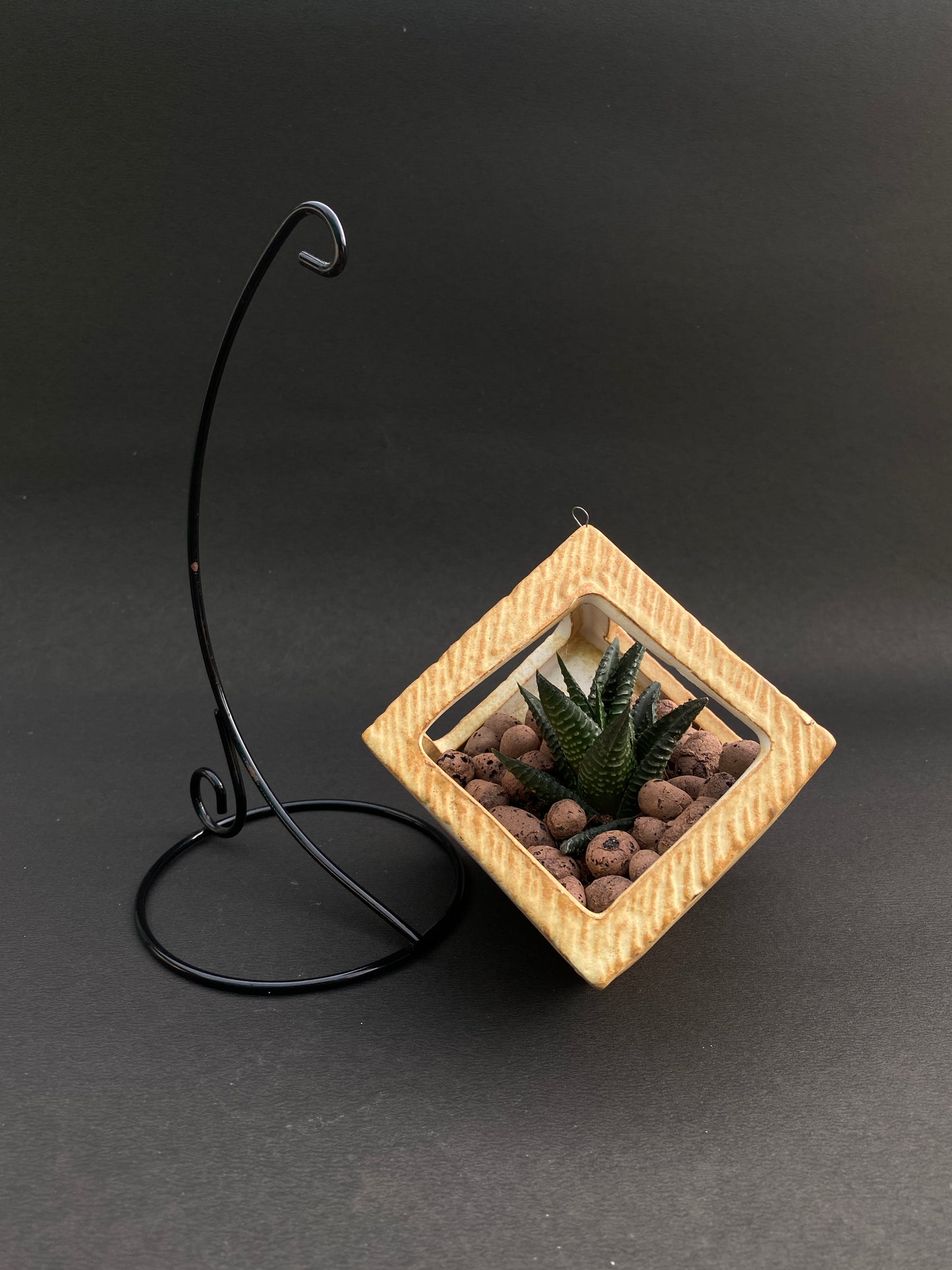 Yellow ceramic planter with metallic stand