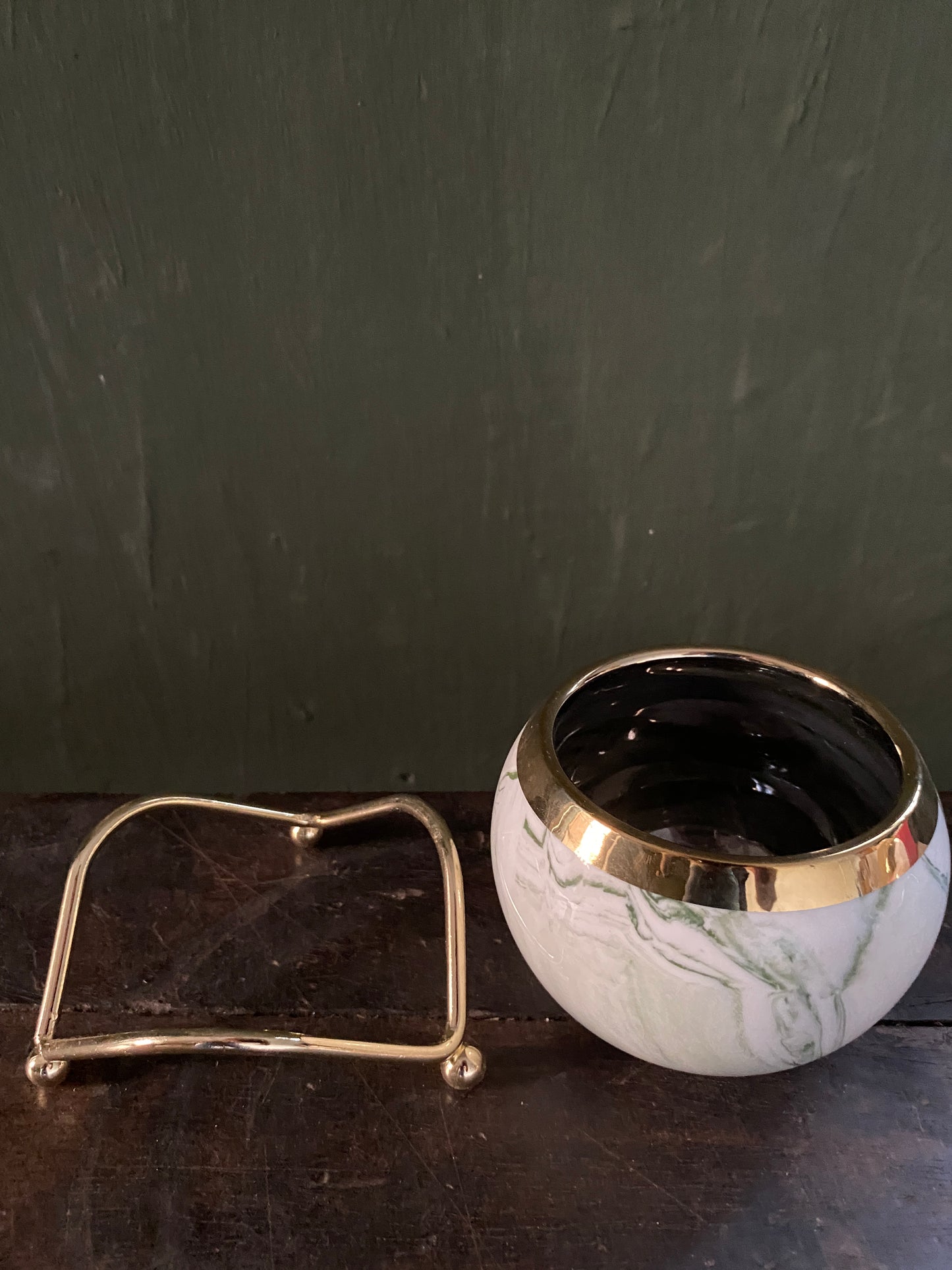 White green marble designed planter with golden stand