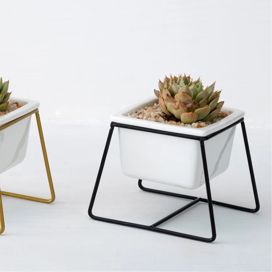 White square ceramic planter with metallic stand