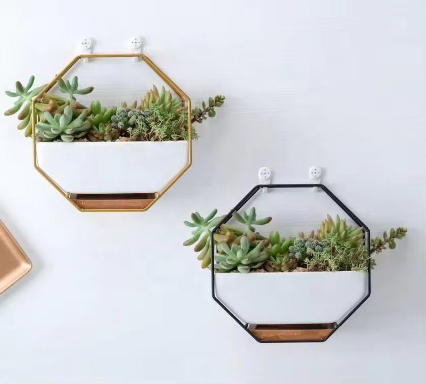 White ceramic planter with wooden base and metallic stand