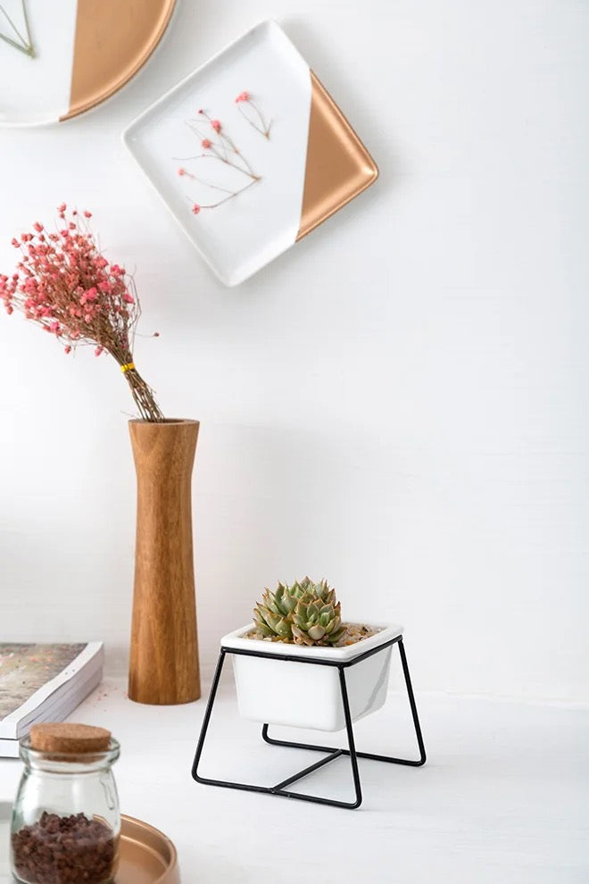 White square ceramic planter with metallic stand