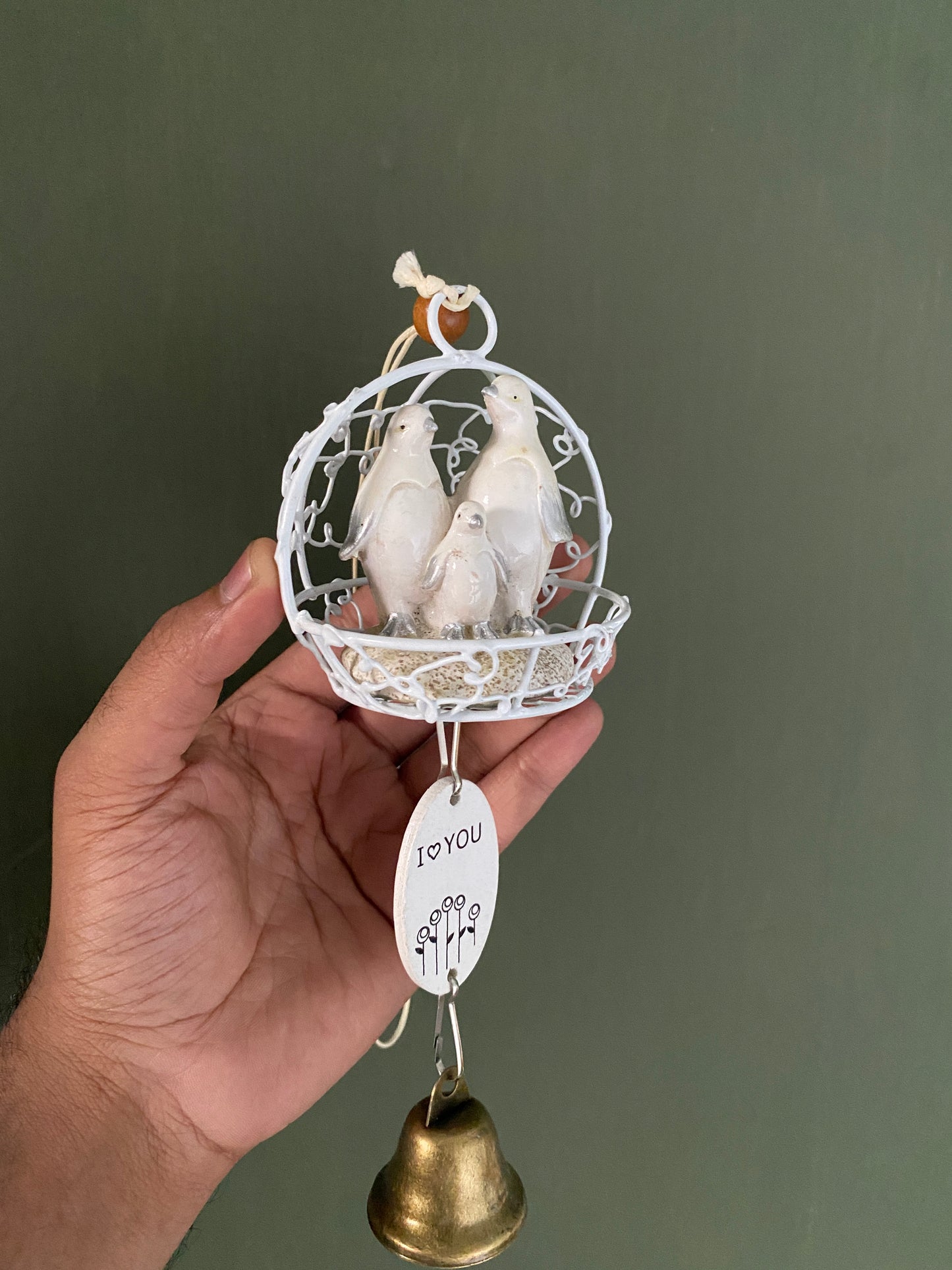 Ceramic penguin figurine in cage themed windchime