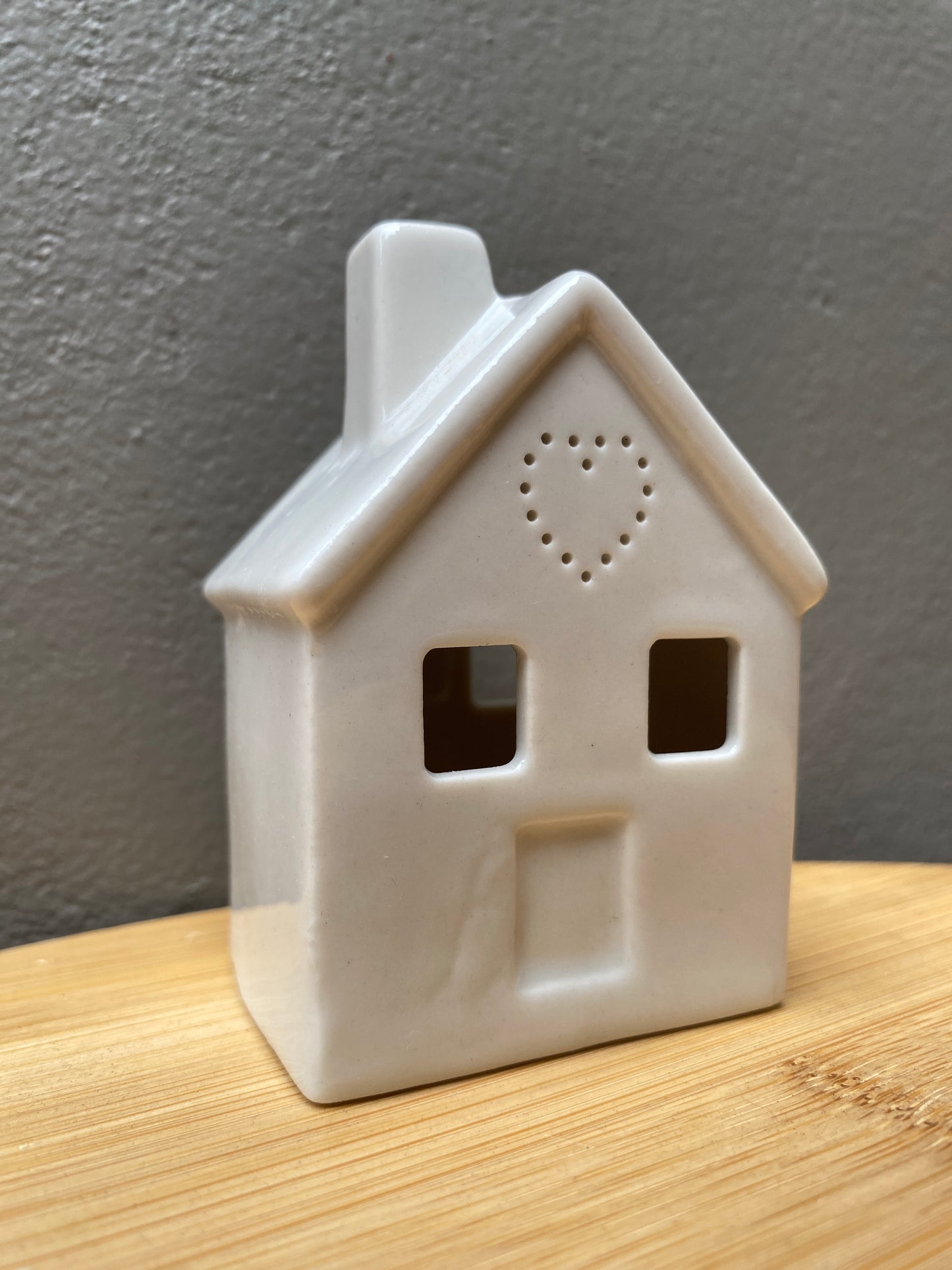 White ceramic small home themed candle holder