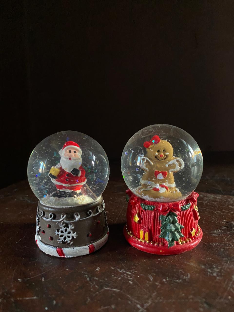 Santa and gingerbread man Christmas snow globes for tabletop decoration